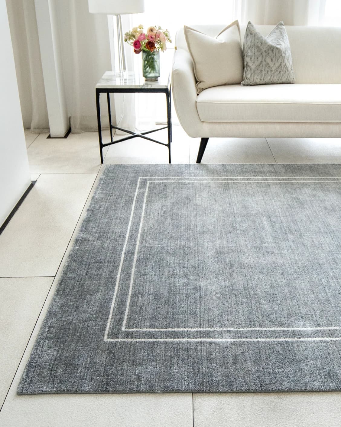 Colin Ashton carpets in blue and white, shown in a lifestyle front view as image 2