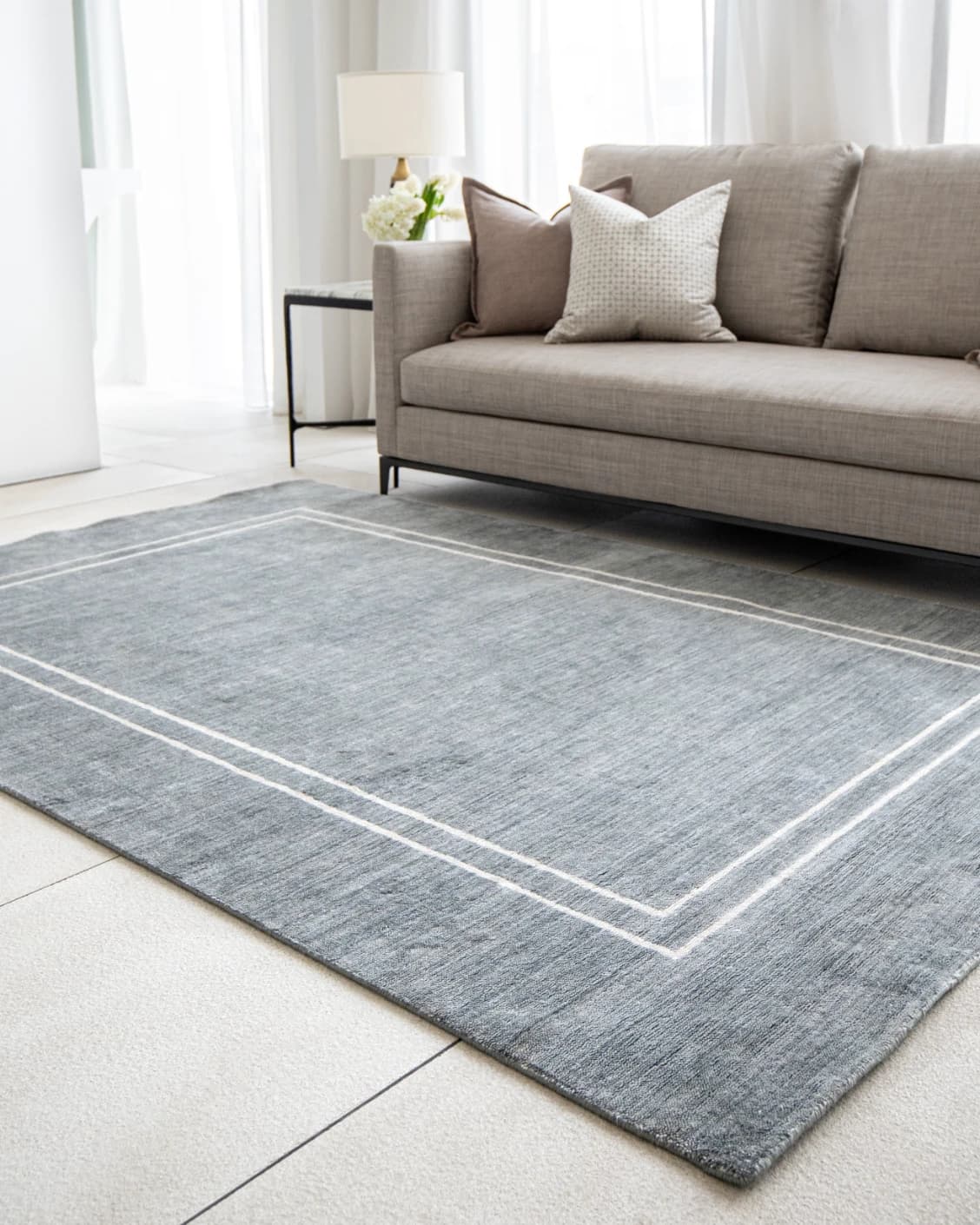 Colin Ashton carpet in blue and white, shown in a lifestyle right view as image 6