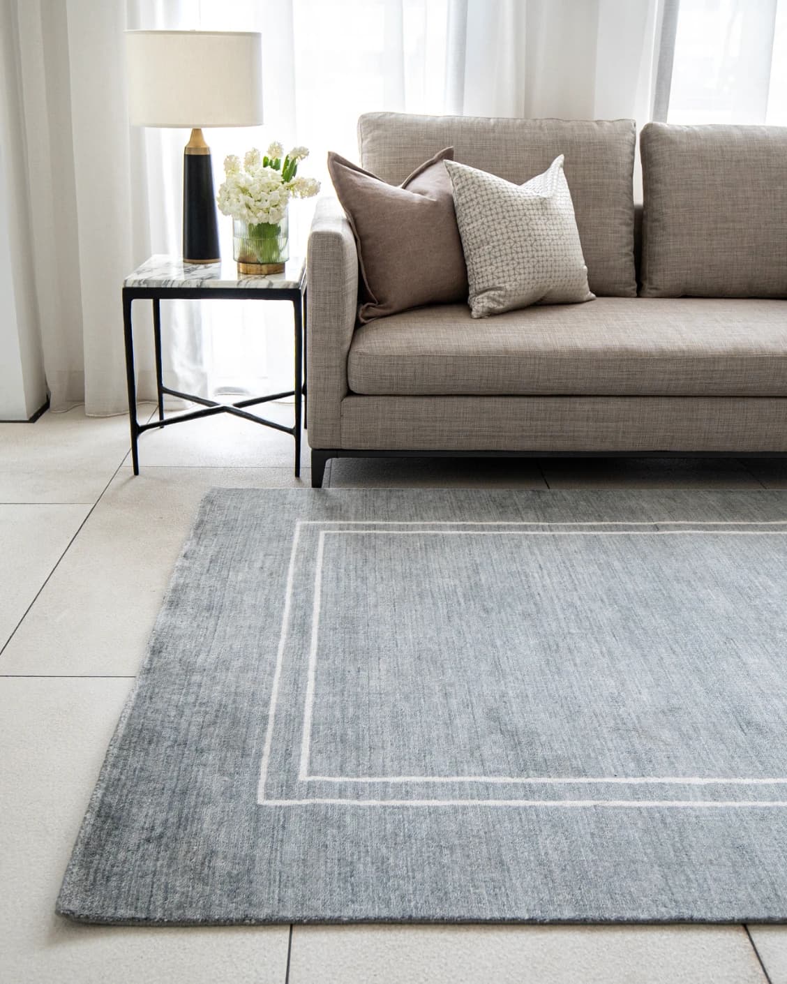 Colin Ashton carpet in blue and white, shown in a lifestyle front view as image 2