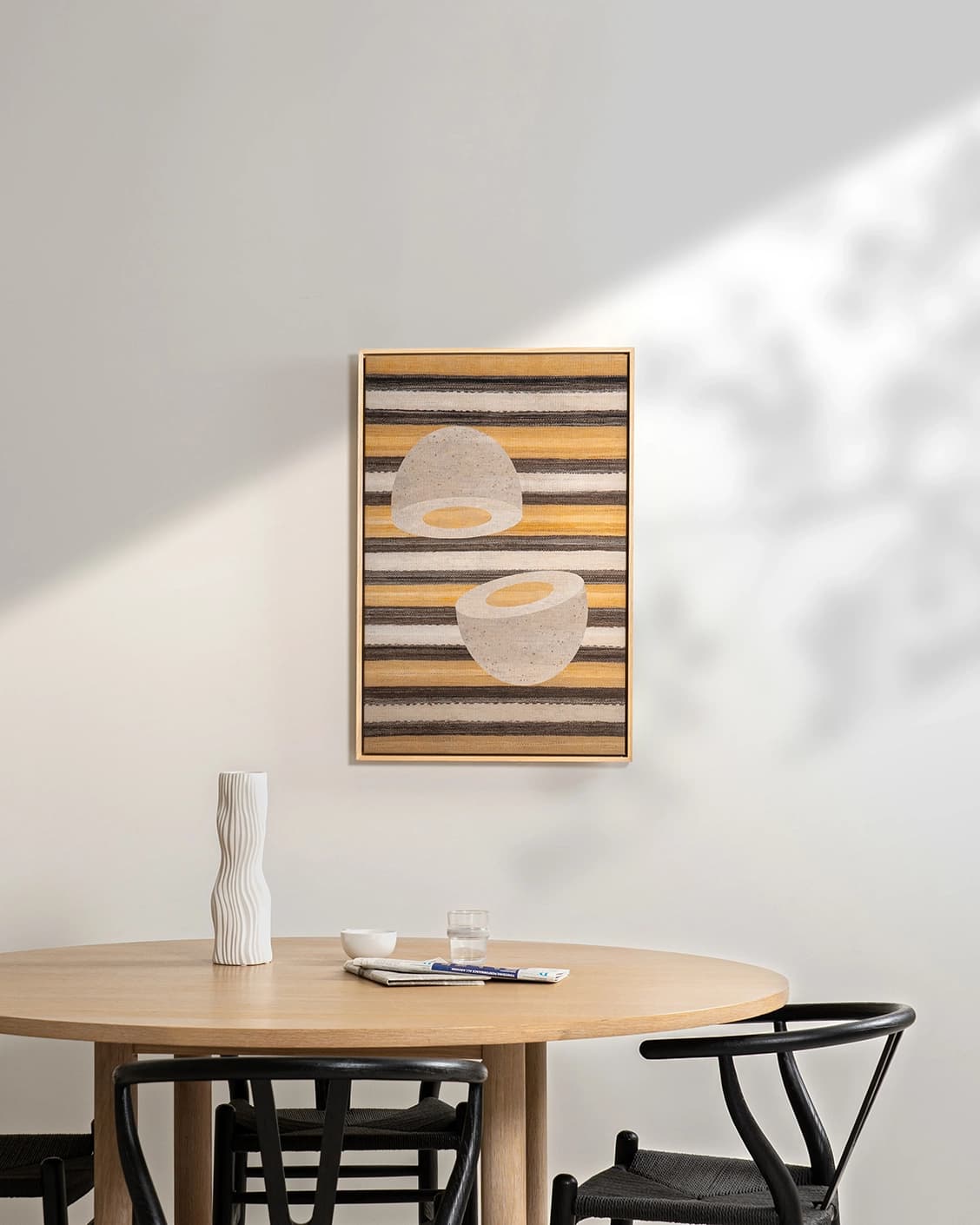 Eggercise canvas in yellow, brown and beige, shown in a lifestyle front view as image 3