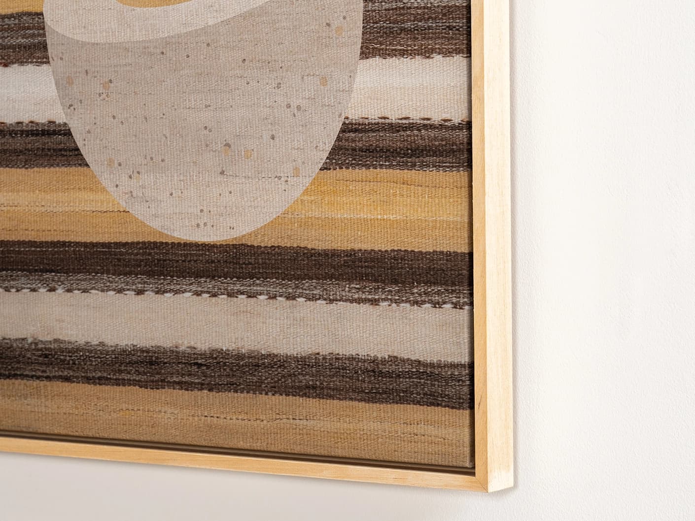 Eggercise canvas in yellow, brown and beige, shown in a lifestyle close-up as image 2