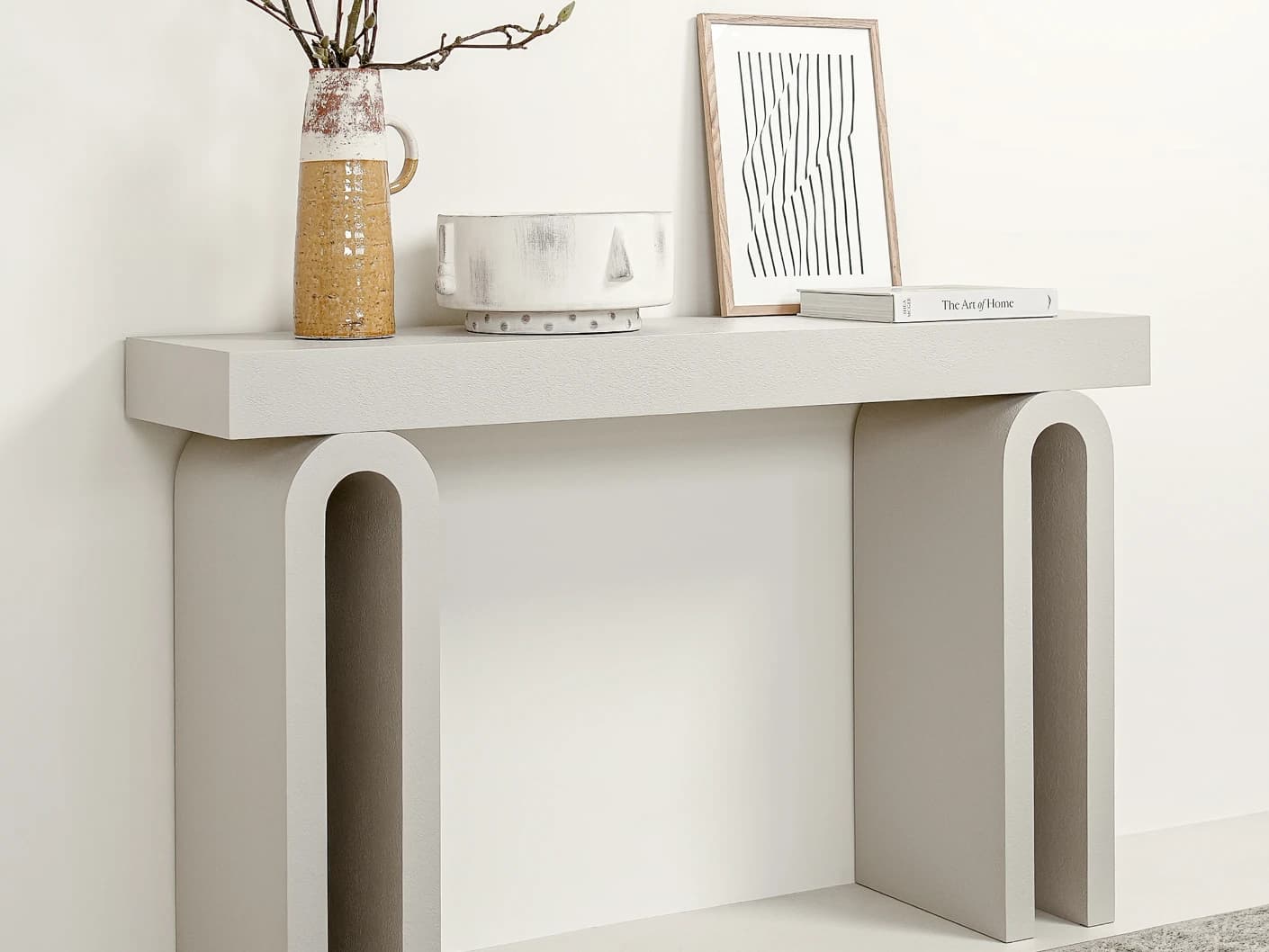 Trento console table in soft ivory and stone, shown in a lifestyle left view as image 3